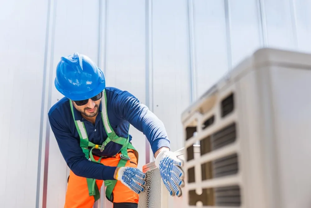 Homeowner reviewing energy savings from a well-maintained HVAC system